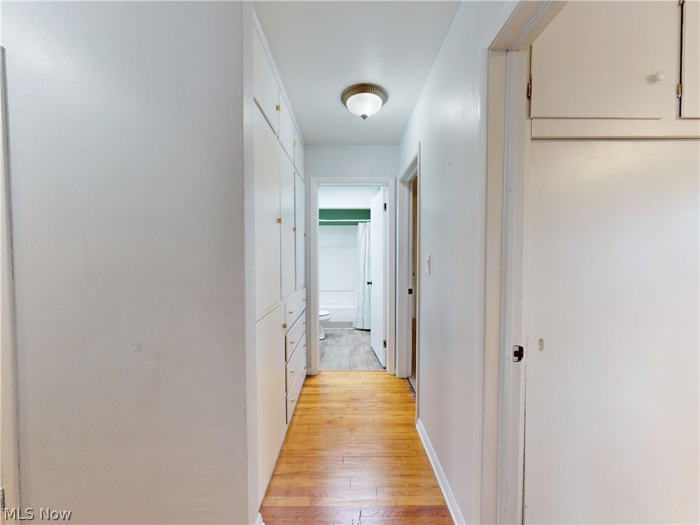 162 South Leavitt Road Amherst, OH 44001 - Photo 22 of 41 Hall with light wood finished floors and baseboards