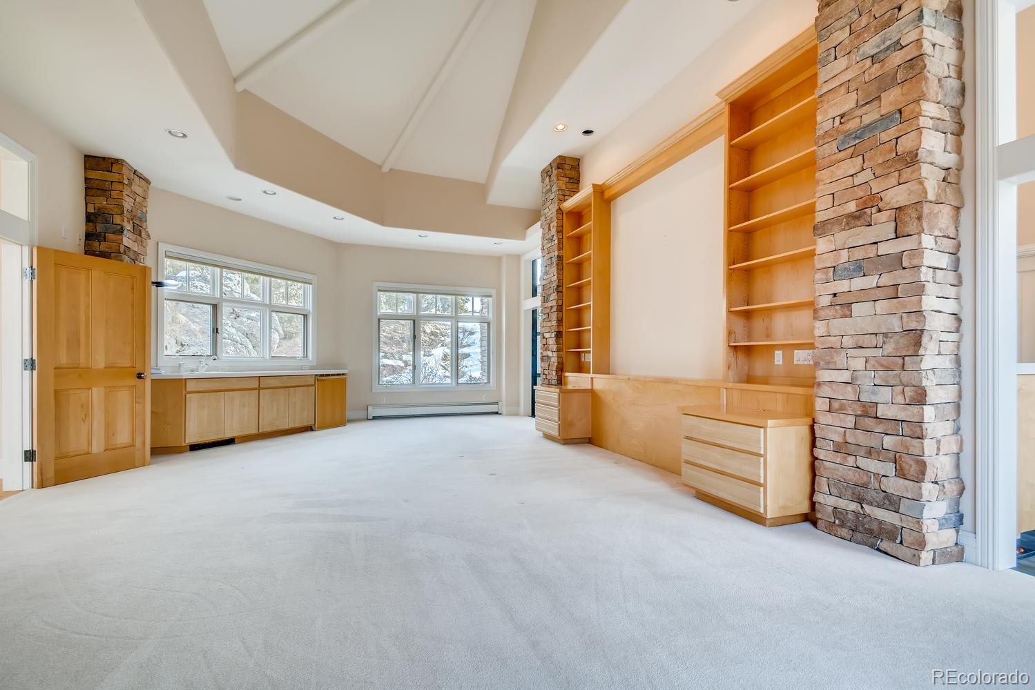 3883 Mountainside Trail Evergreen, CO 80439 - Photo 17 of 36 a view of an empty room with a window