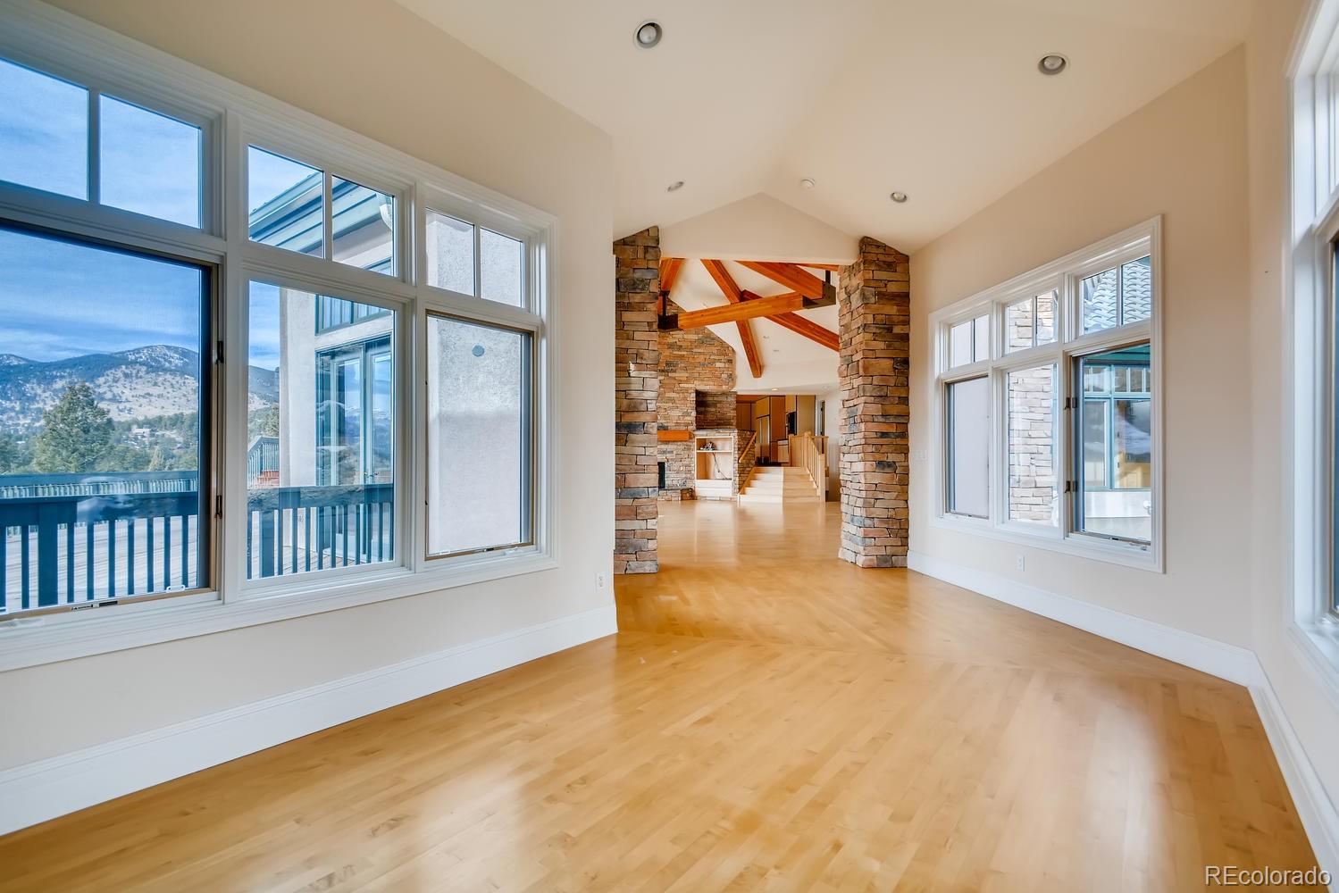 3883 Mountainside Trail Evergreen, CO 80439 - Photo 22 of 36 a view of an entryway with wooden floor