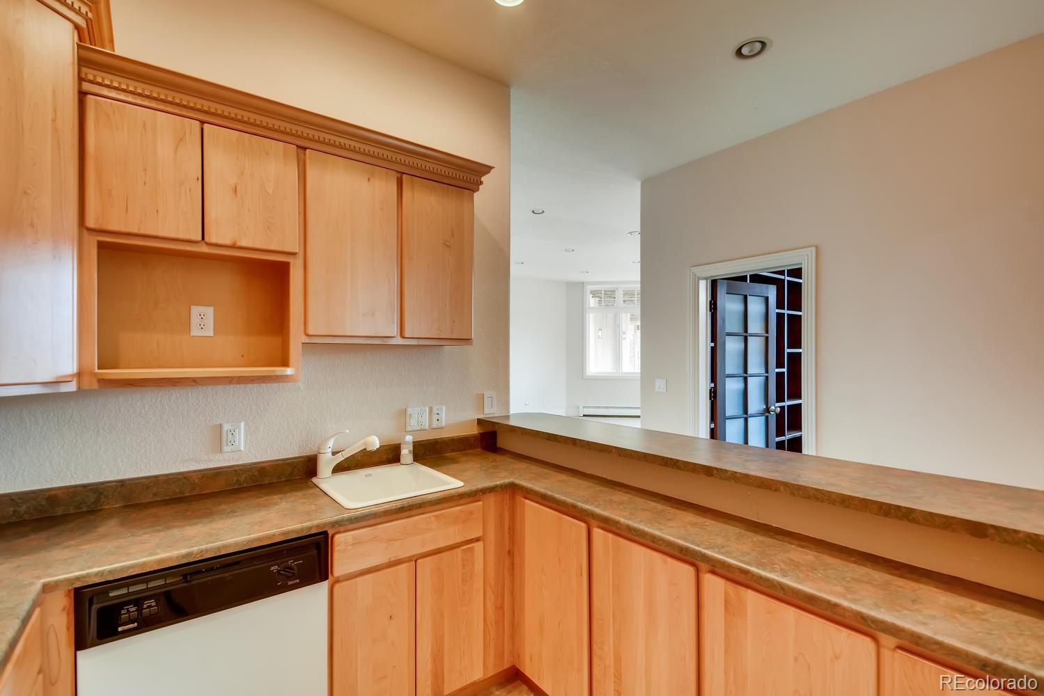 3883 Mountainside Trail Evergreen, CO 80439 - Photo 30 of 36 a utility room with a sink cabinets and utility