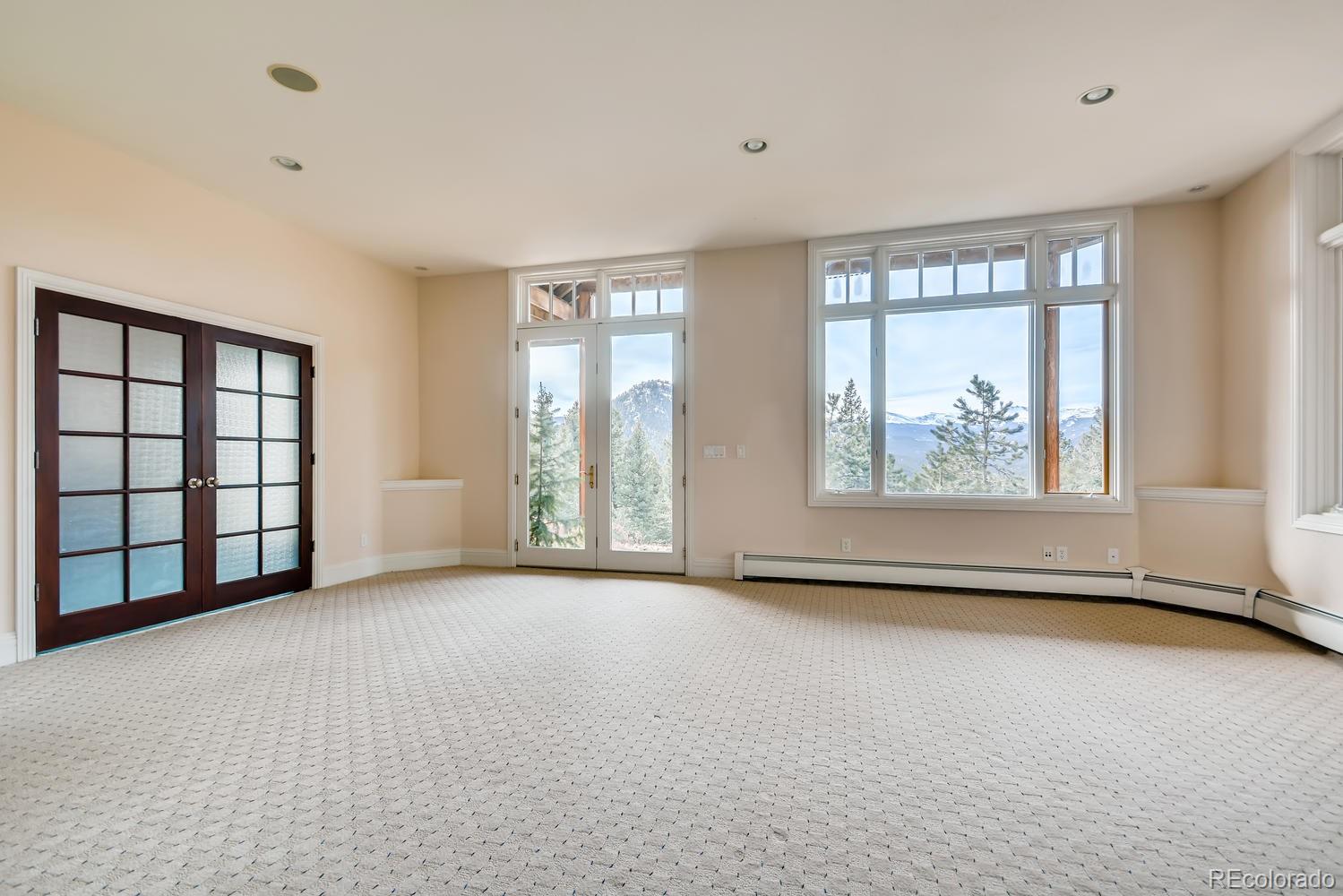 3883 Mountainside Trail Evergreen, CO 80439 - Photo 33 of 36 a view of an empty room with a window