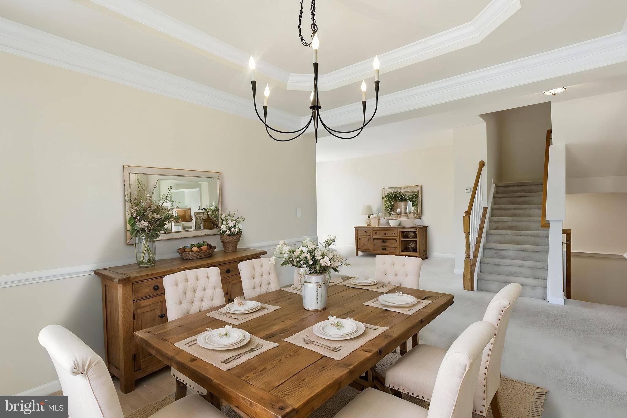 19617 Edgemont Square Ashburn, VA 20147 - Photo 10 of 65 a view of a dining room with furniture wooden floor and a chandelier