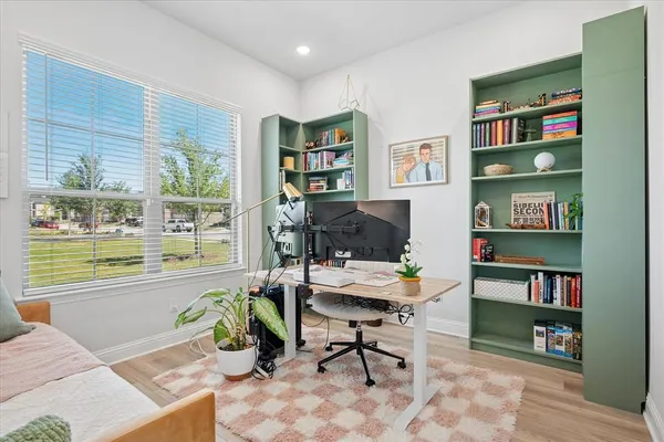 a workspace with furniture and a book shelf