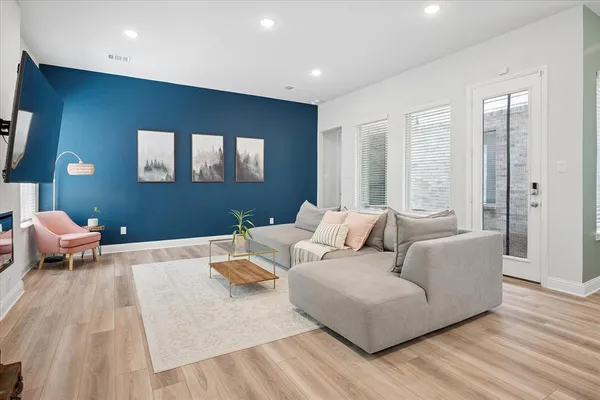 a living room with furniture and a large window