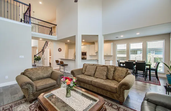 a large kitchen with kitchen island a sink table and chairs