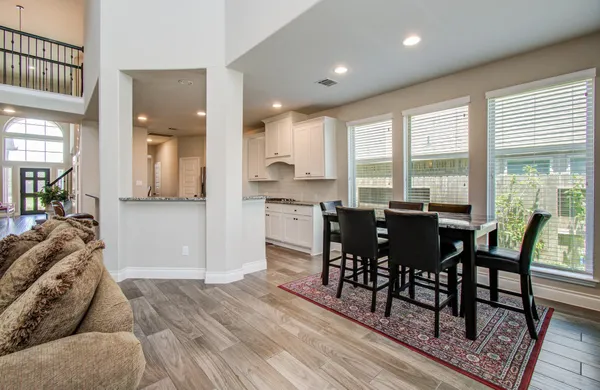 a bed room with a bed and a chair