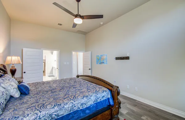 a living room with furniture a ceiling fan and a rug