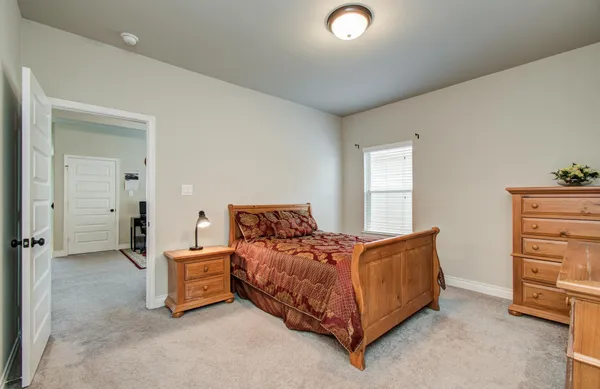 a utility room with wooden floor washer and dryer