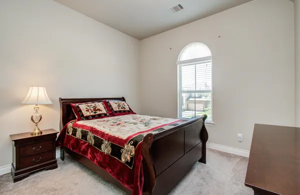 a front view of a house with yard and porch