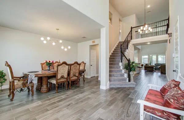 a view of a dining room with furniture window and wooden floor