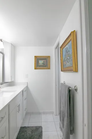 a view of a hallway to rooms