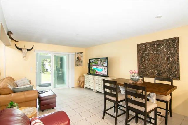 a work room with furniture and a large window