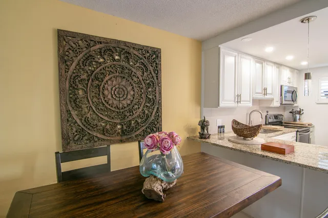 a living room with wooden floor furniture and a wooden floor