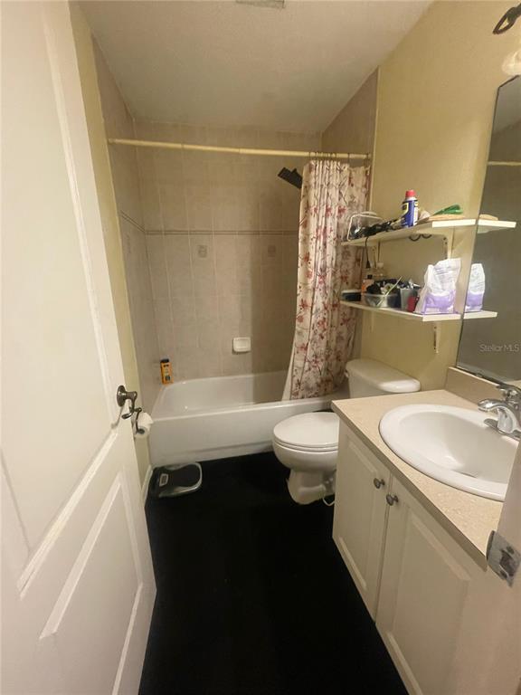 396 Kettering Road Deltona, FL 32725 - Photo 22 of 25 a bathroom with a sink a toilet and shower