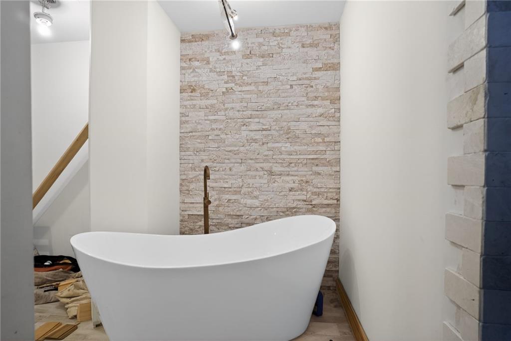 843 Fox Street Northwest Atlanta, GA 30318 - Photo 19 of 30 a bathroom with a bathtub