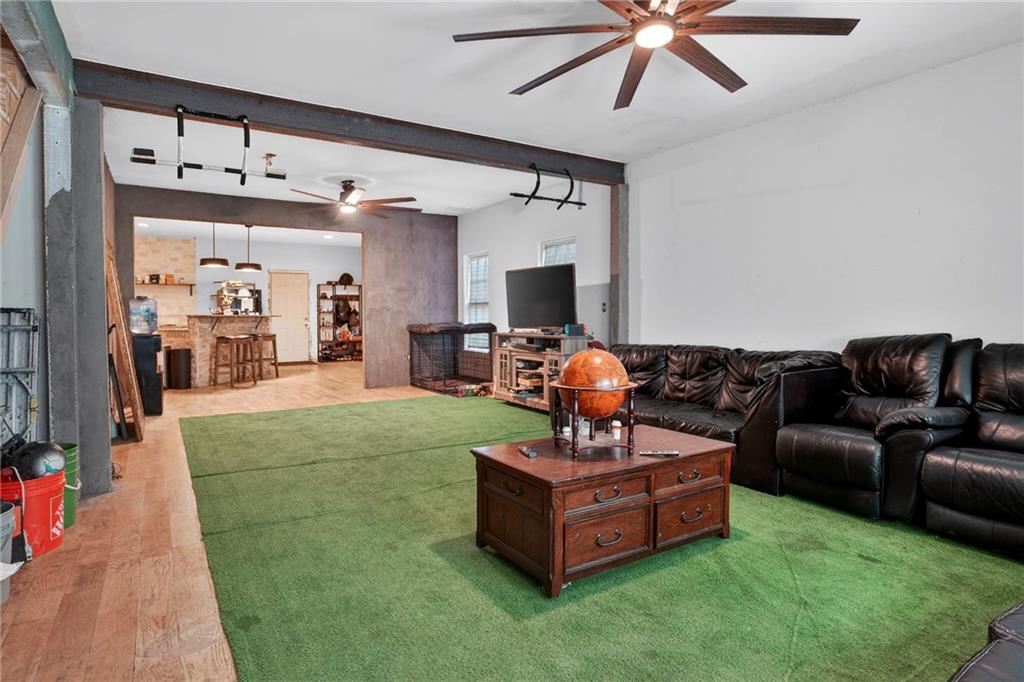 843 Fox Street Northwest Atlanta, GA 30318 - Photo 2 of 30 a living room with furniture and a flat screen tv