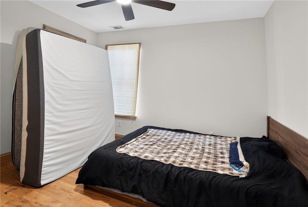 843 Fox Street Northwest Atlanta, GA 30318 - Photo 24 of 30 a bedroom with a bed and a window