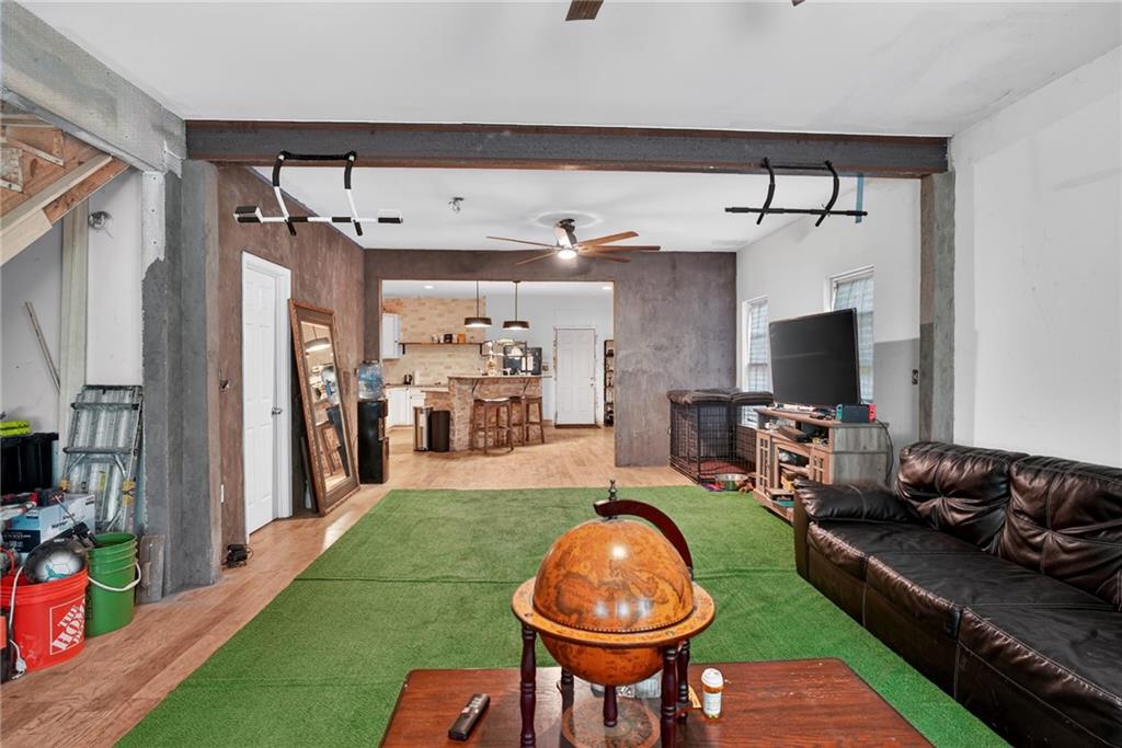 843 Fox Street Northwest Atlanta, GA 30318 - Photo 4 of 30 a room with furniture a flat screen tv and a fireplace