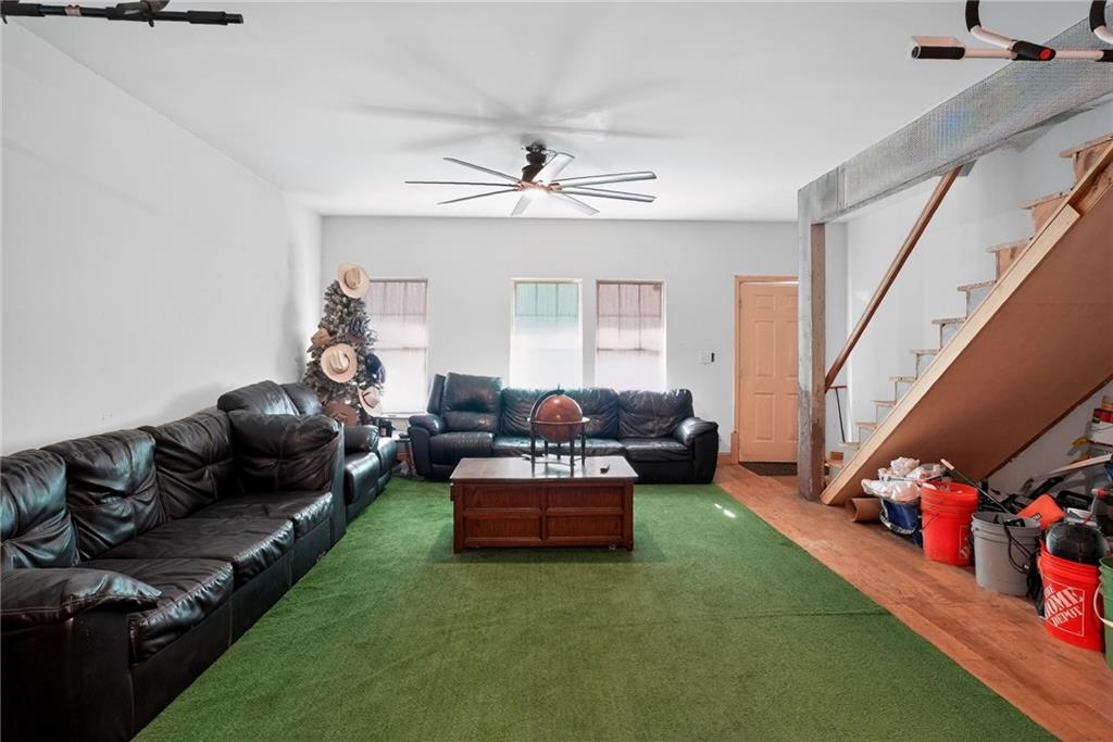 843 Fox Street Northwest Atlanta, GA 30318 - Photo 6 of 30 a living room with furniture and a chandelier