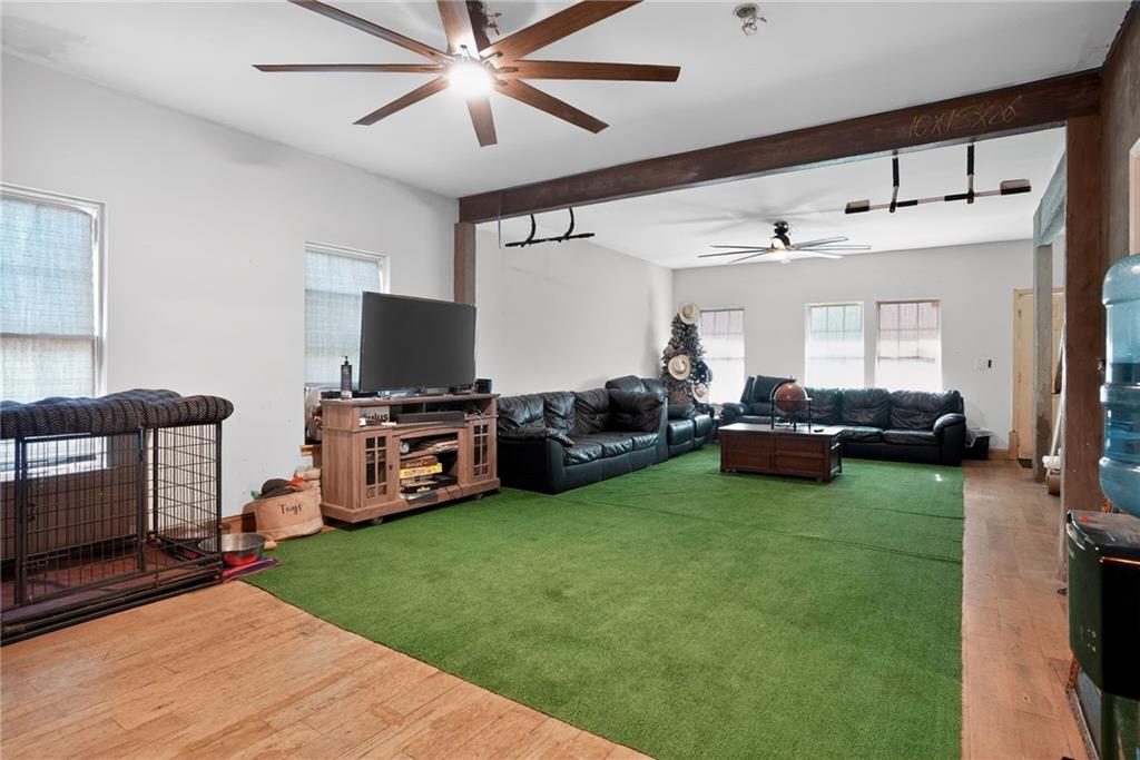 843 Fox Street Northwest Atlanta, GA 30318 - Photo 7 of 30 a living room with furniture and a flat screen tv