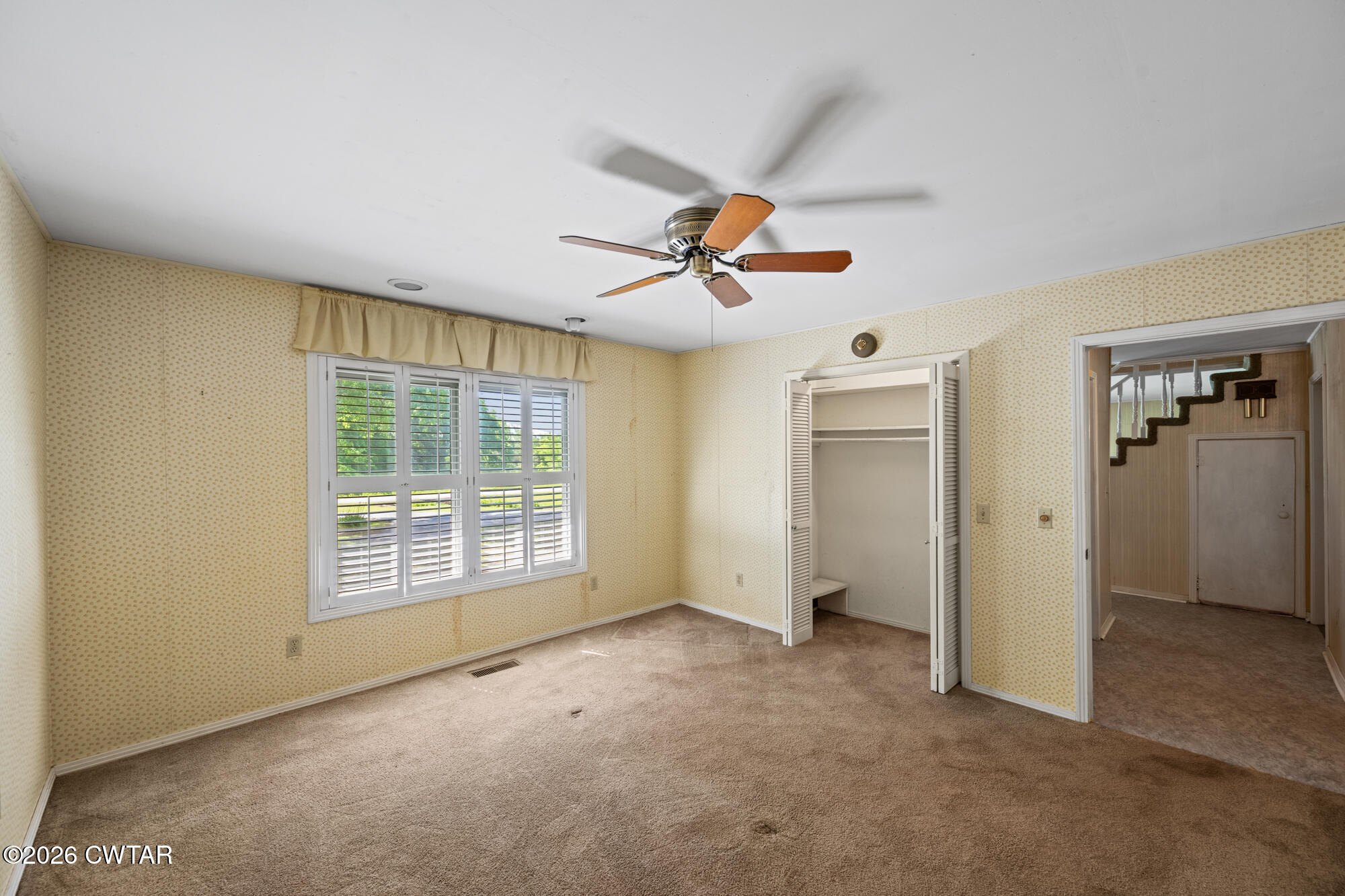 8932 Mt Carmel Road Decaturville, TN 38329 - Photo 12 of 47 an empty room with windows and closet