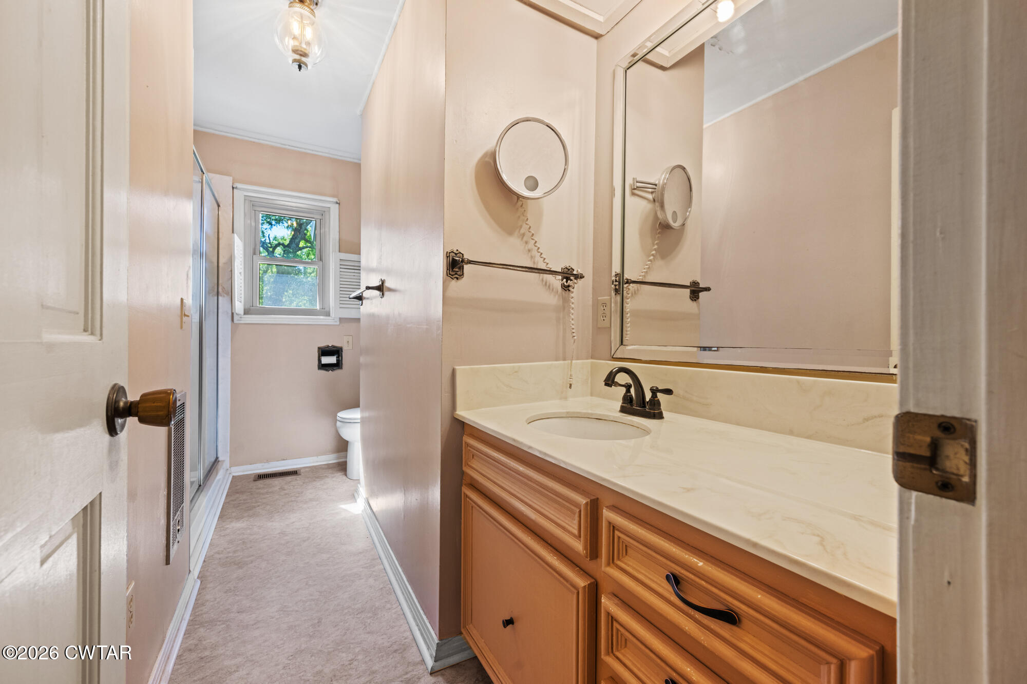 8932 Mt Carmel Road Decaturville, TN 38329 - Photo 15 of 47 a en suite bathroom with a granite countertop sink and a mirror
