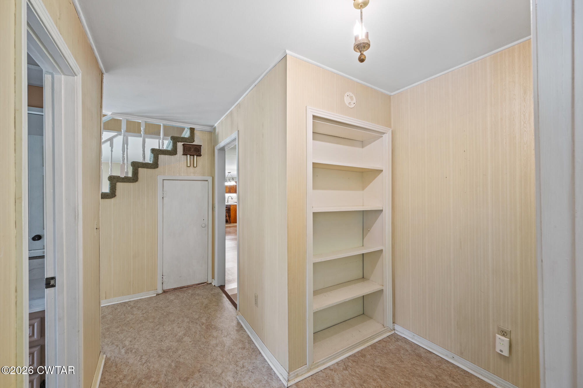 8932 Mt Carmel Road Decaturville, TN 38329 - Photo 16 of 47 a view of walk in closet with empty racks