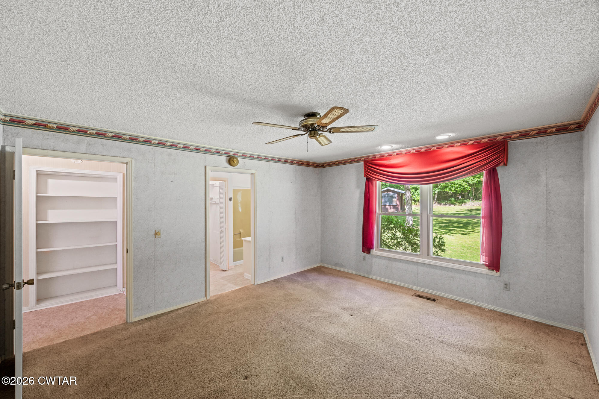 8932 Mt Carmel Road Decaturville, TN 38329 - Photo 17 of 47 a view of an empty room with a window