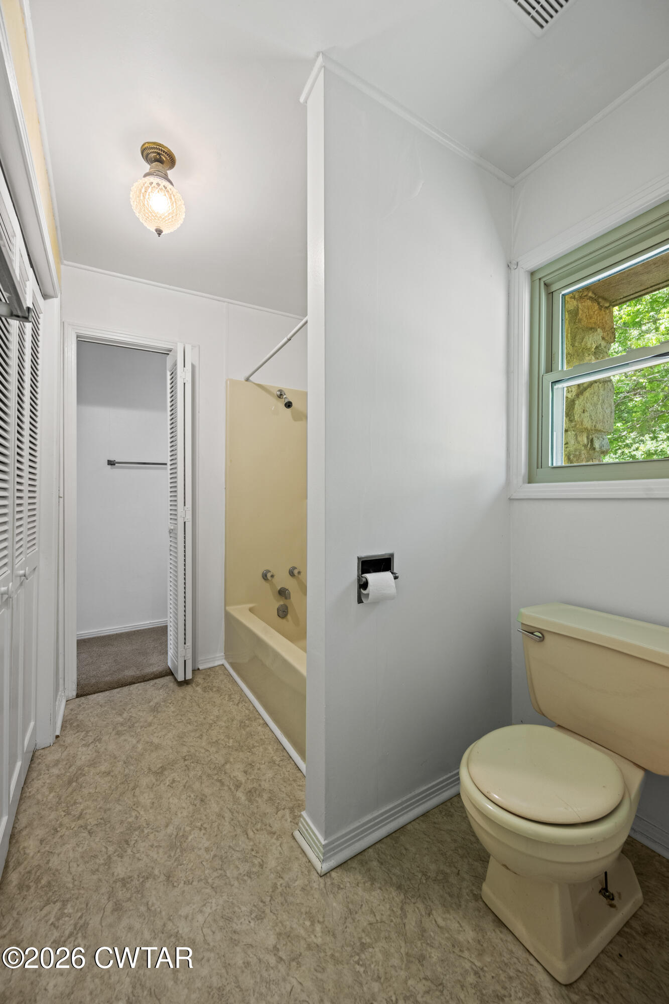 8932 Mt Carmel Road Decaturville, TN 38329 - Photo 25 of 47 a bathroom with a toilet and a shower