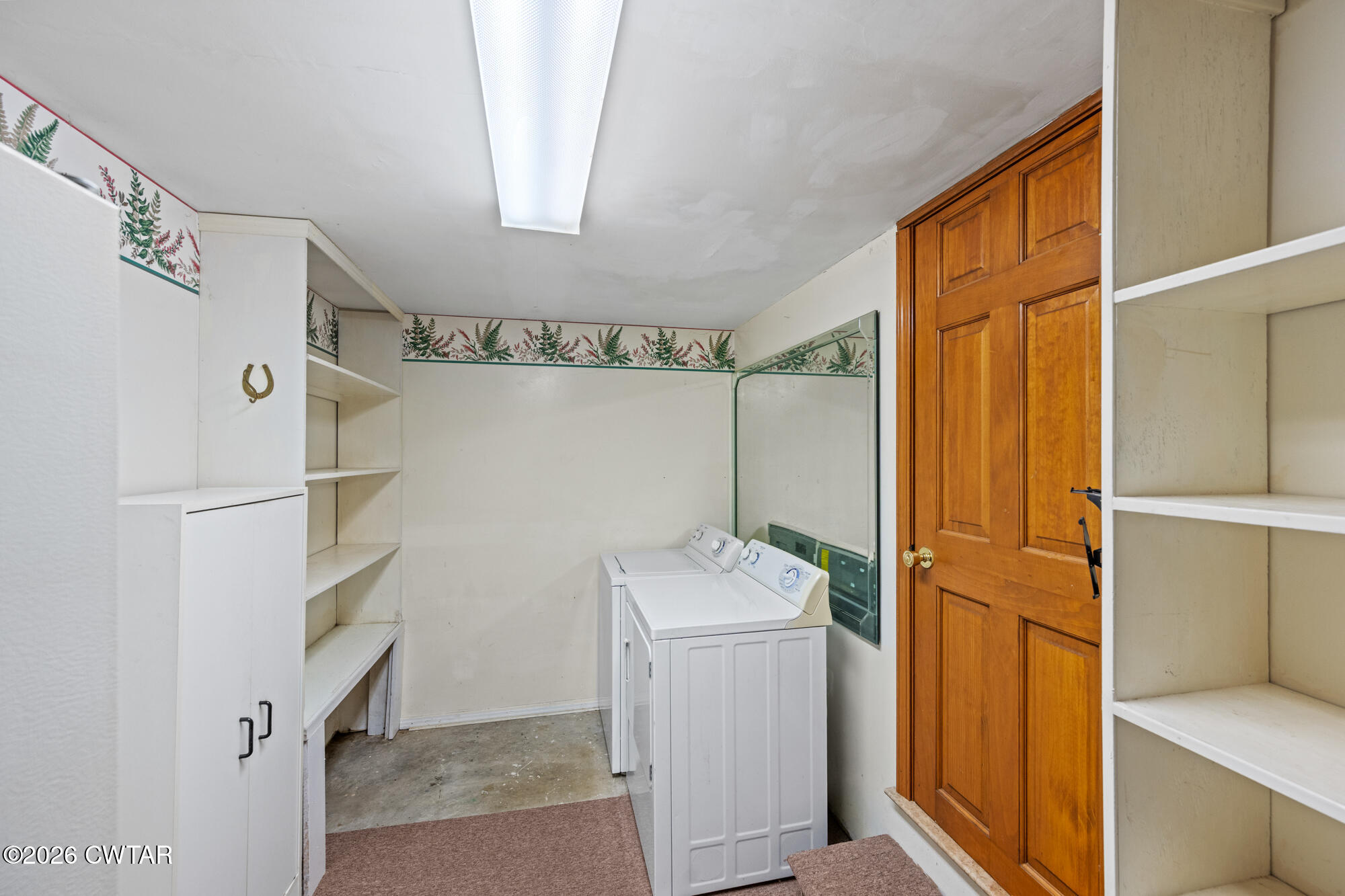 8932 Mt Carmel Road Decaturville, TN 38329 - Photo 33 of 47 a utility room with dryer and washer