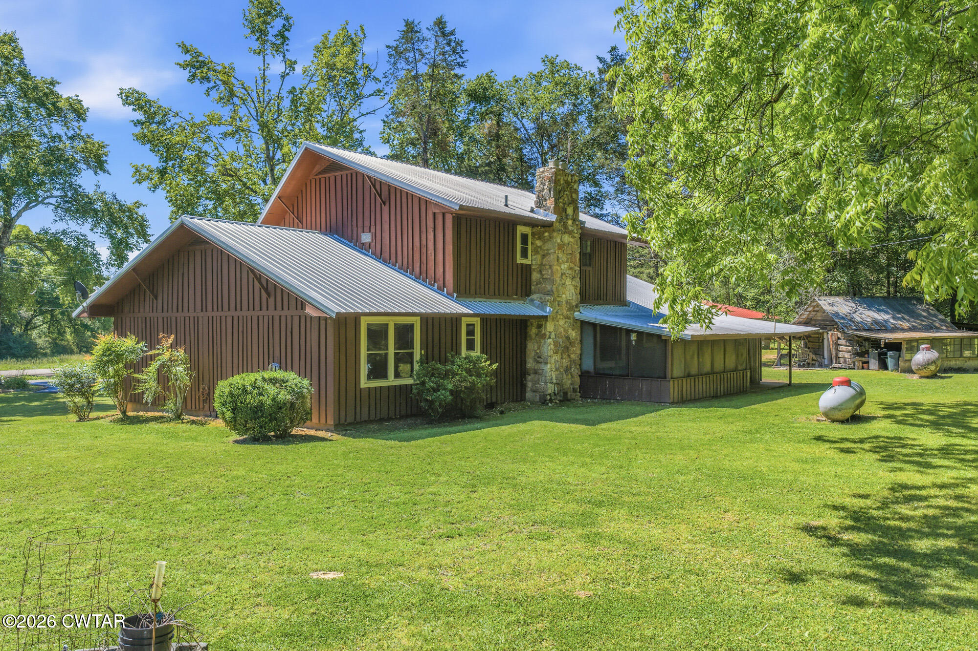 8932 Mt Carmel Road Decaturville, TN 38329 - Photo 36 of 47 a house that has a big yard