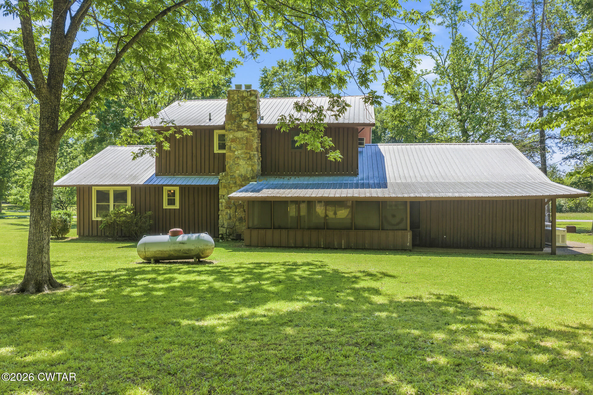 8932 Mt Carmel Road Decaturville, TN 38329 - Photo 37 of 47 a view of a house with a yard