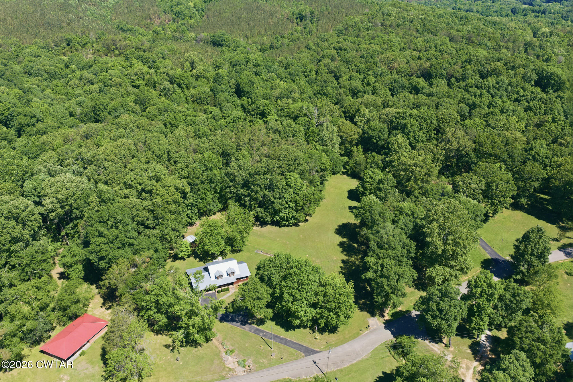 8932 Mt Carmel Road Decaturville, TN 38329 - Photo 40 of 47 an aerial view of a house with a yard