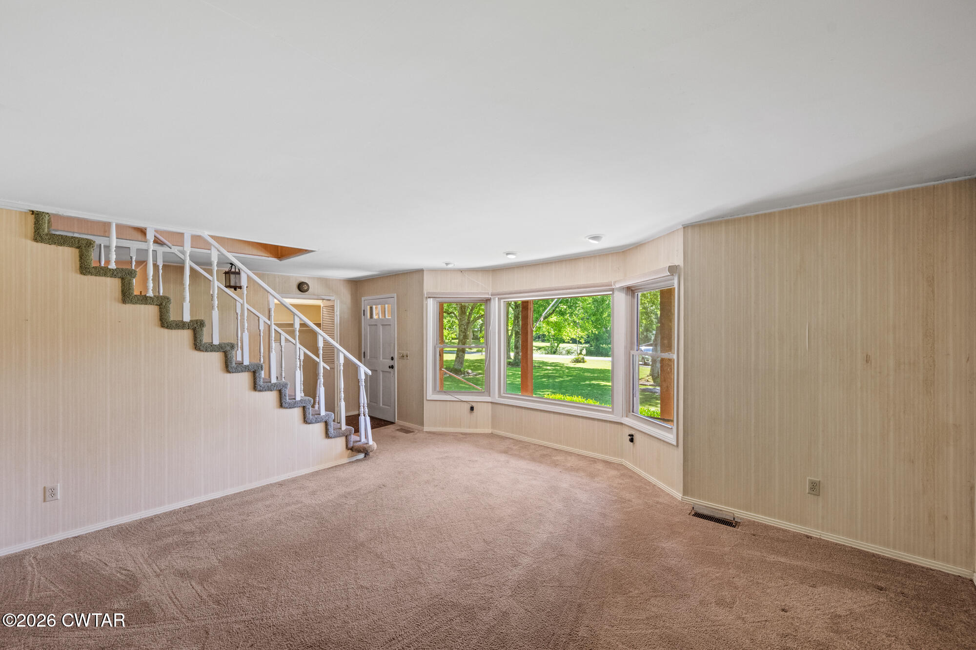 8932 Mt Carmel Road Decaturville, TN 38329 - Photo 10 of 47 a view of an empty room with stairs