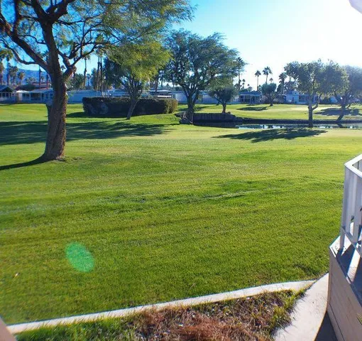 a view of swimming pool with an outdoor space and seating area