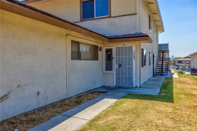 a view of a kitchen with a sink and cabinets