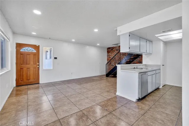 a view of a storage & utility room with two washing machine