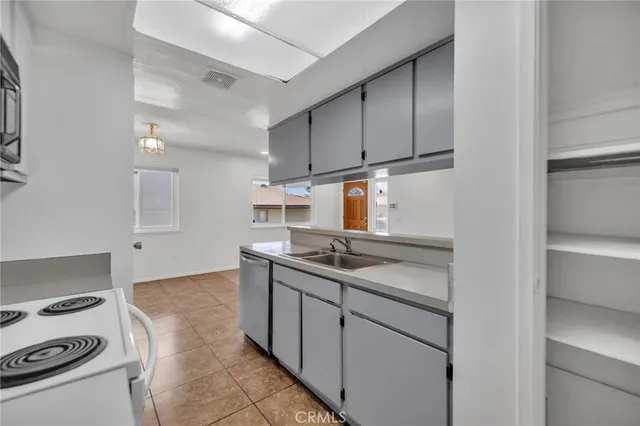 a view of an empty room and a window