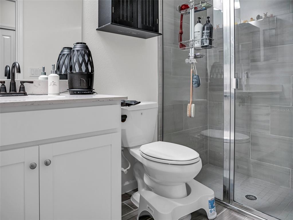 7474 Southwest 78th Terrace Ocala, FL 34481 - Photo 17 of 58 a bathroom with a toilet and a sink