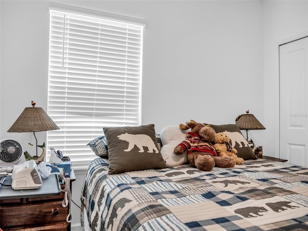 7474 Southwest 78th Terrace Ocala, FL 34481 - Photo 38 of 58 a bedroom with a bed and a window