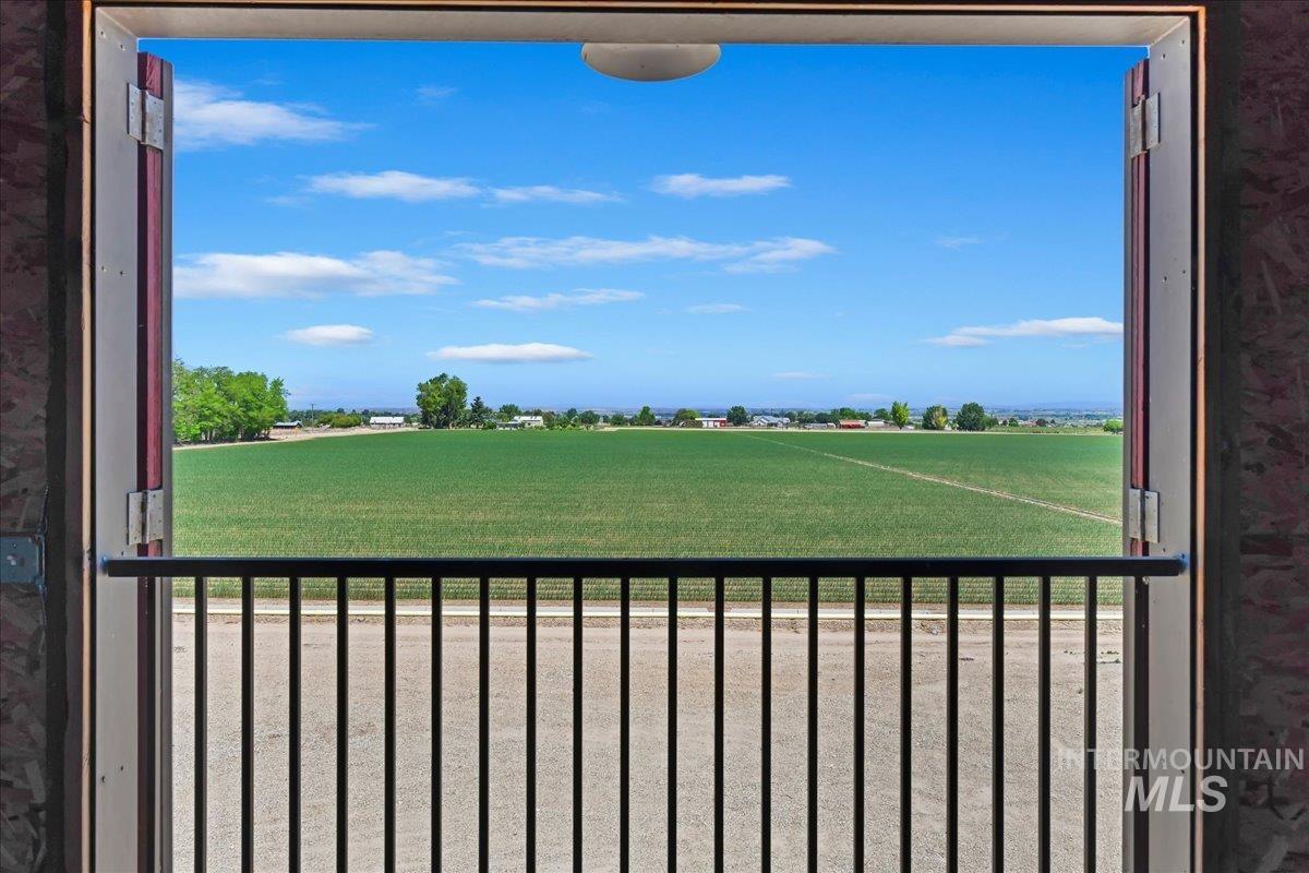 19234 Top Road Caldwell, ID 83607 - Photo 36 of 50 View of yard featuring a balcony and a rural view