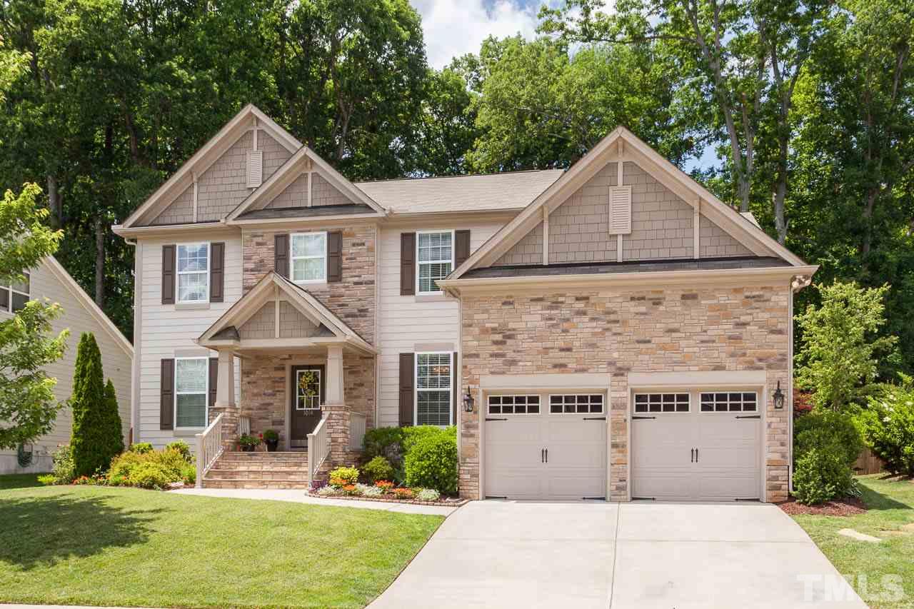 1014 Vino Drive Raleigh, NC 27607 - Photo 1 of 25 a front view of a house with a yard