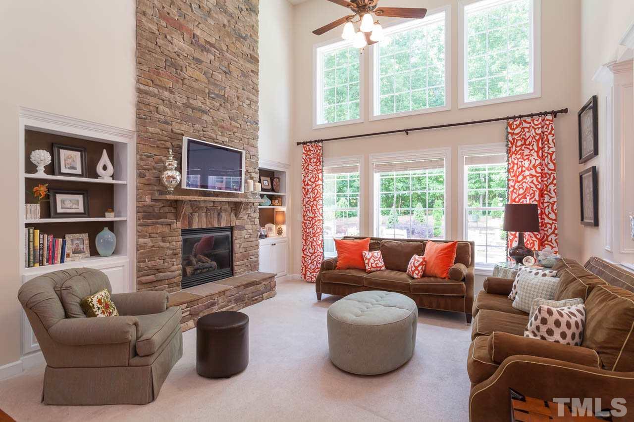 1014 Vino Drive Raleigh, NC 27607 - Photo 12 of 25 a living room with fireplace furniture and a large window