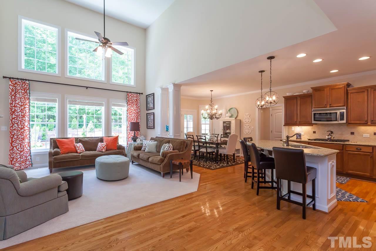1014 Vino Drive Raleigh, NC 27607 - Photo 13 of 25 a living room with fireplace furniture and a large window