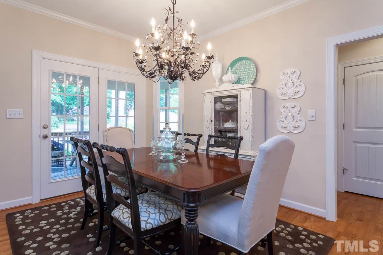 1014 Vino Drive Raleigh, NC 27607 - Photo 15 of 25 a view of a dining room with furniture window and wooden floor