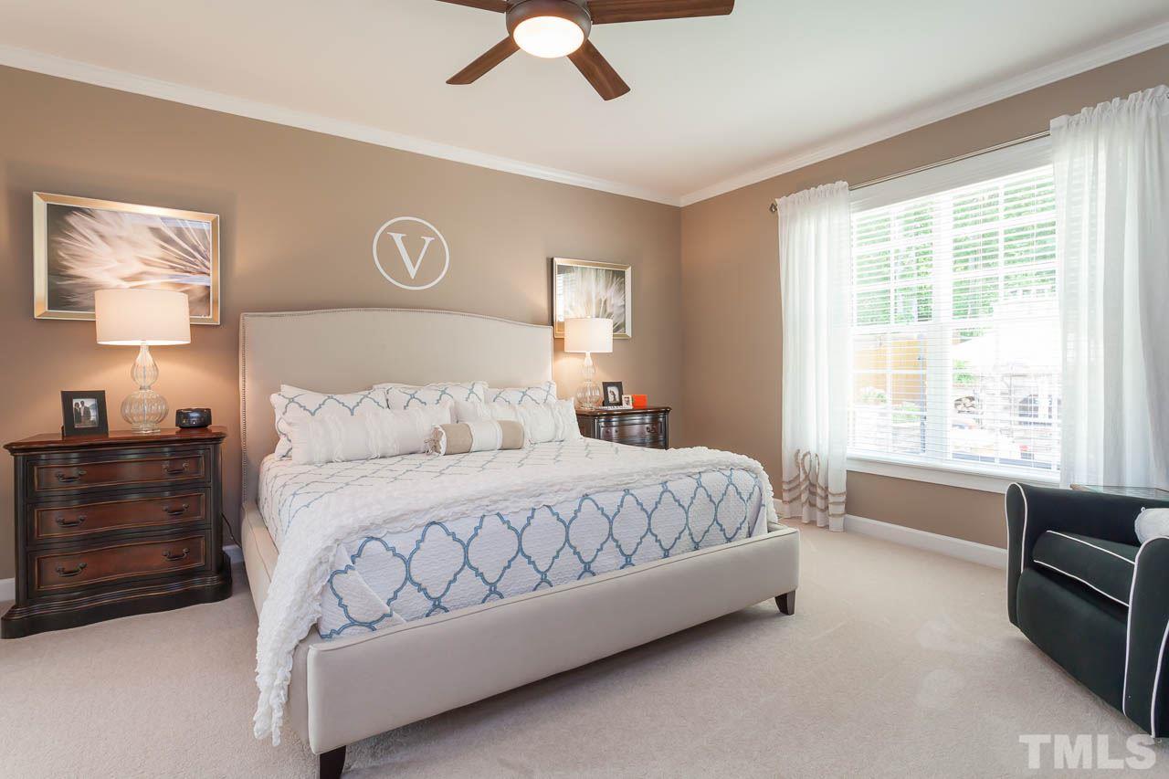1014 Vino Drive Raleigh, NC 27607 - Photo 16 of 25 a spacious bedroom with a bed and a window