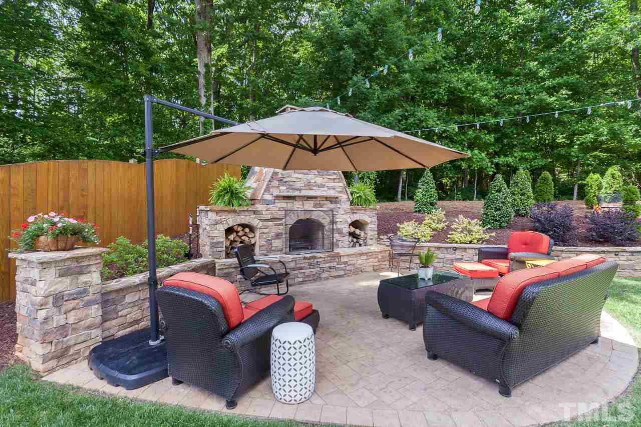 1014 Vino Drive Raleigh, NC 27607 - Photo 3 of 25 a view of a patio with couches chairs under an umbrella