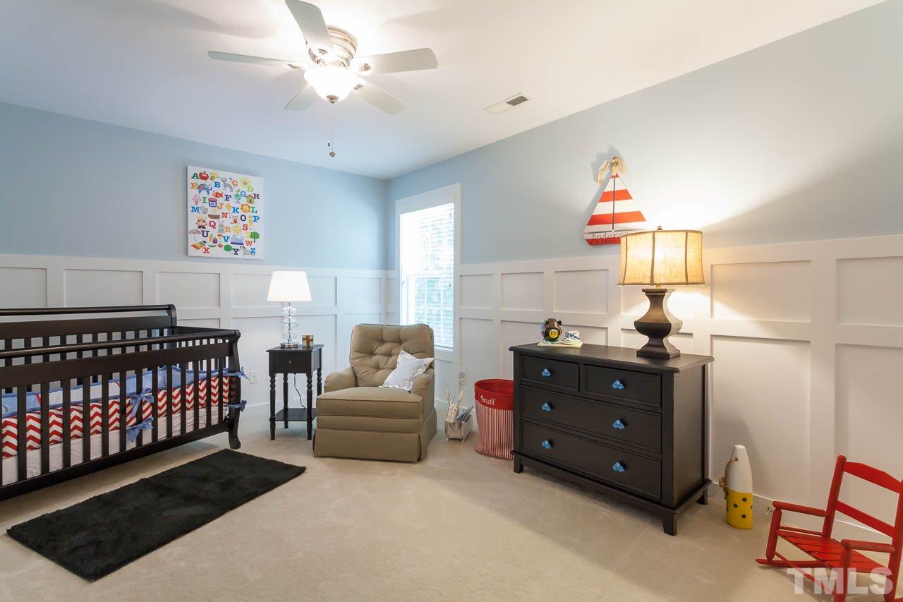 1014 Vino Drive Raleigh, NC 27607 - Photo 22 of 25 a bedroom with furniture and a window
