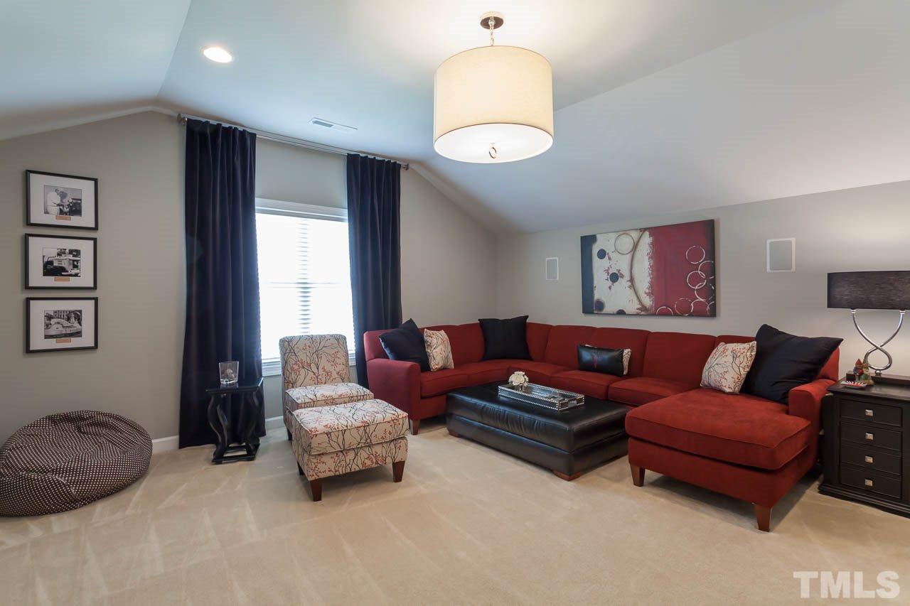 1014 Vino Drive Raleigh, NC 27607 - Photo 25 of 25 a living room with furniture and a large window