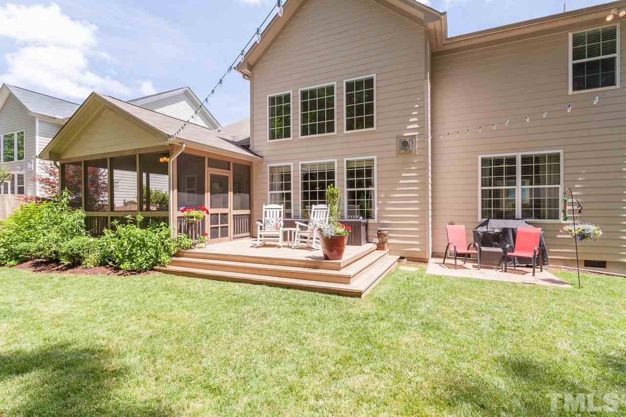 1014 Vino Drive Raleigh, NC 27607 - Photo 6 of 25 a view of a house with a backyard and a patio